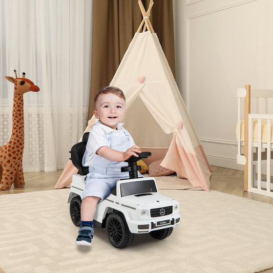 Smiling baby sitting in the white baby walker car in a nursery room