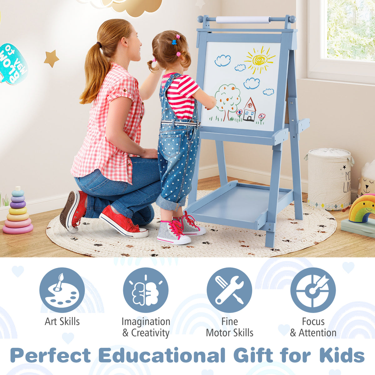 the art easel in a playroom with a child and adult drawing together