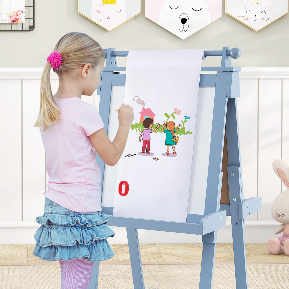 the art easel with a paper roll pulled down for a child to draw on