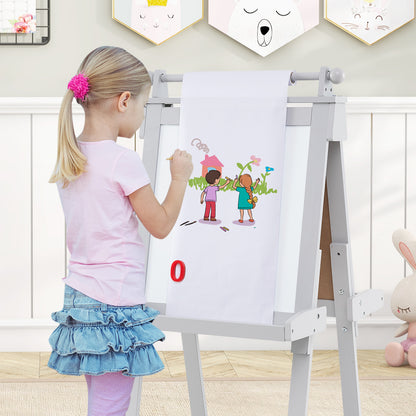 Girl drawing on the paper roll of the grey double-sided art easel