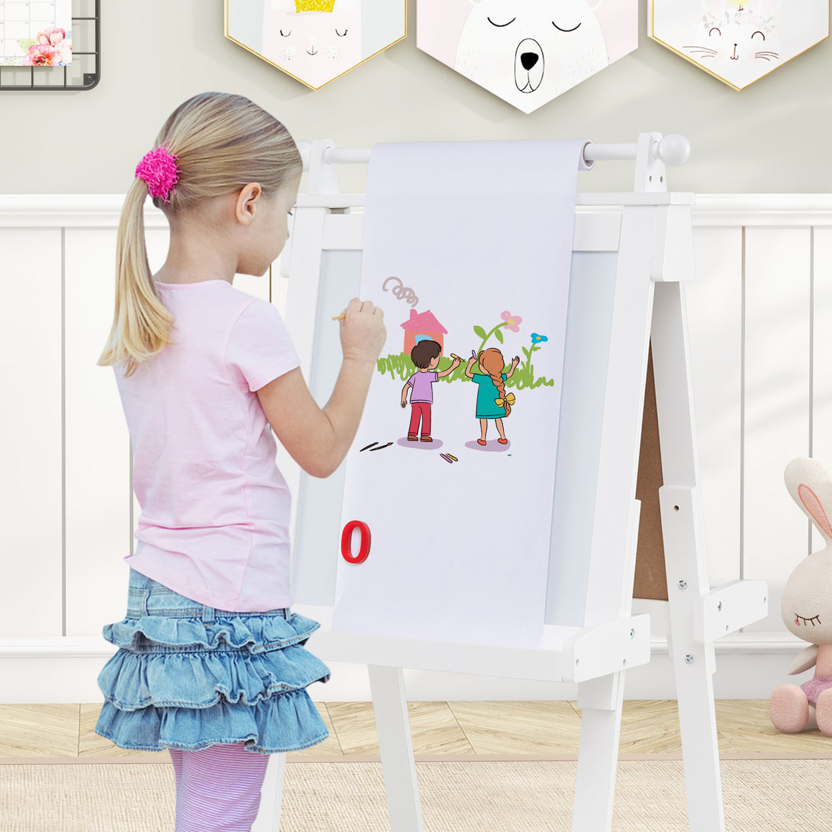 the art easel with a paper roll extended for a young girl to draw on in a bedroom