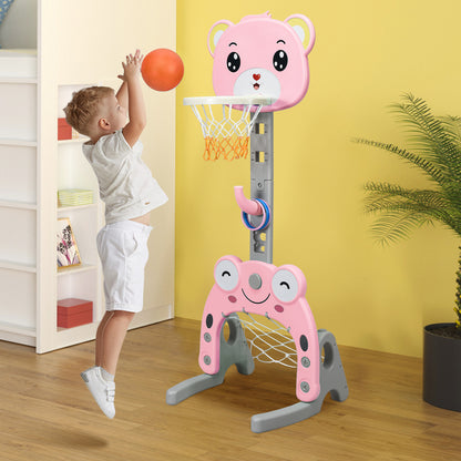 The pink kids basketball hoop and stand set with a boy playing basketball indoors