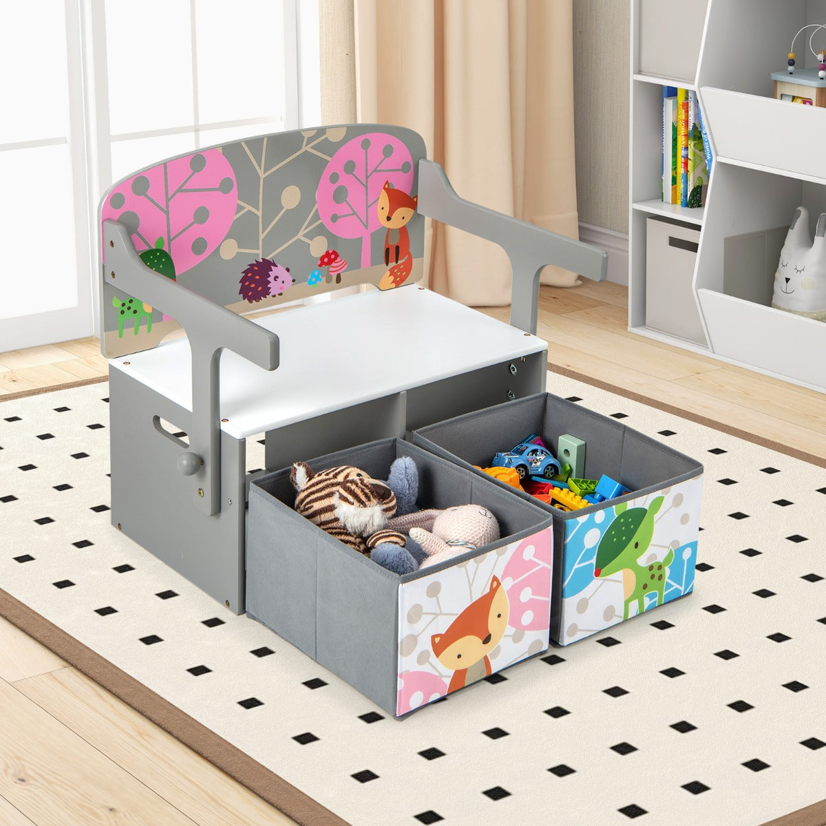 The kids activity bench with storage bins pulled out showing toys and stuffed animals inside