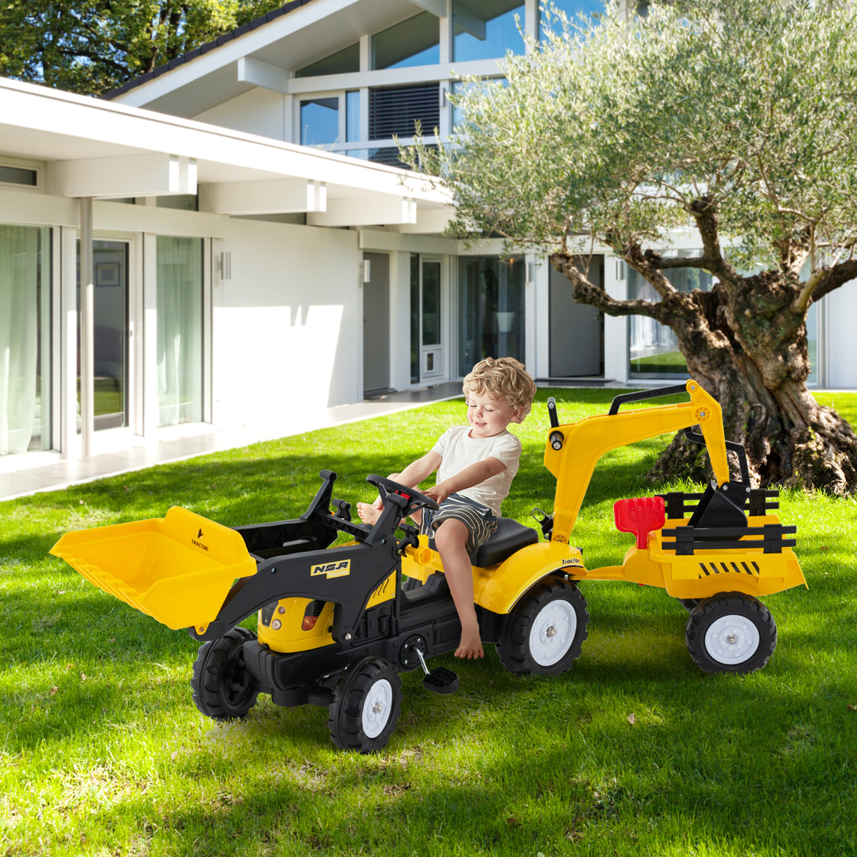 A young boy rides the yellow and black pedal excavator toy in a garden setting