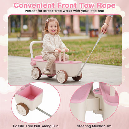 A child rides the pink push car with a rope attached for pulling