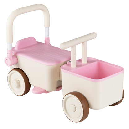 Close up of the pink push and pedal ride on toy with storage basket