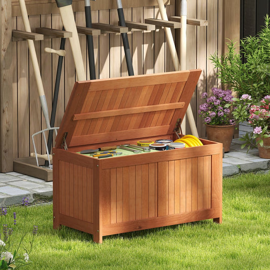 The patio storage bench stool, open lid showing garden tools and hose inside