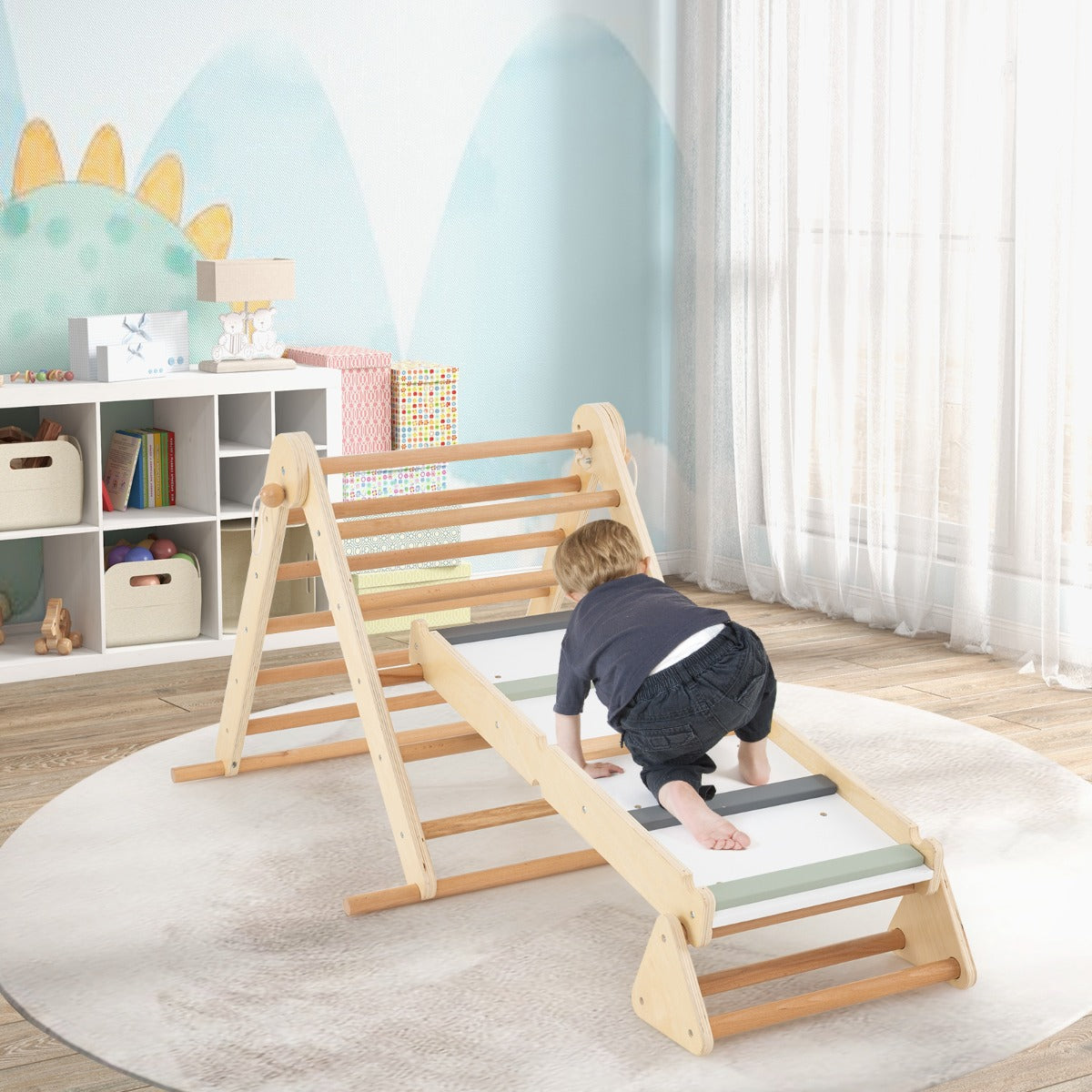A toddler climbs the ramp of the wooden climbing frame in a nursery room