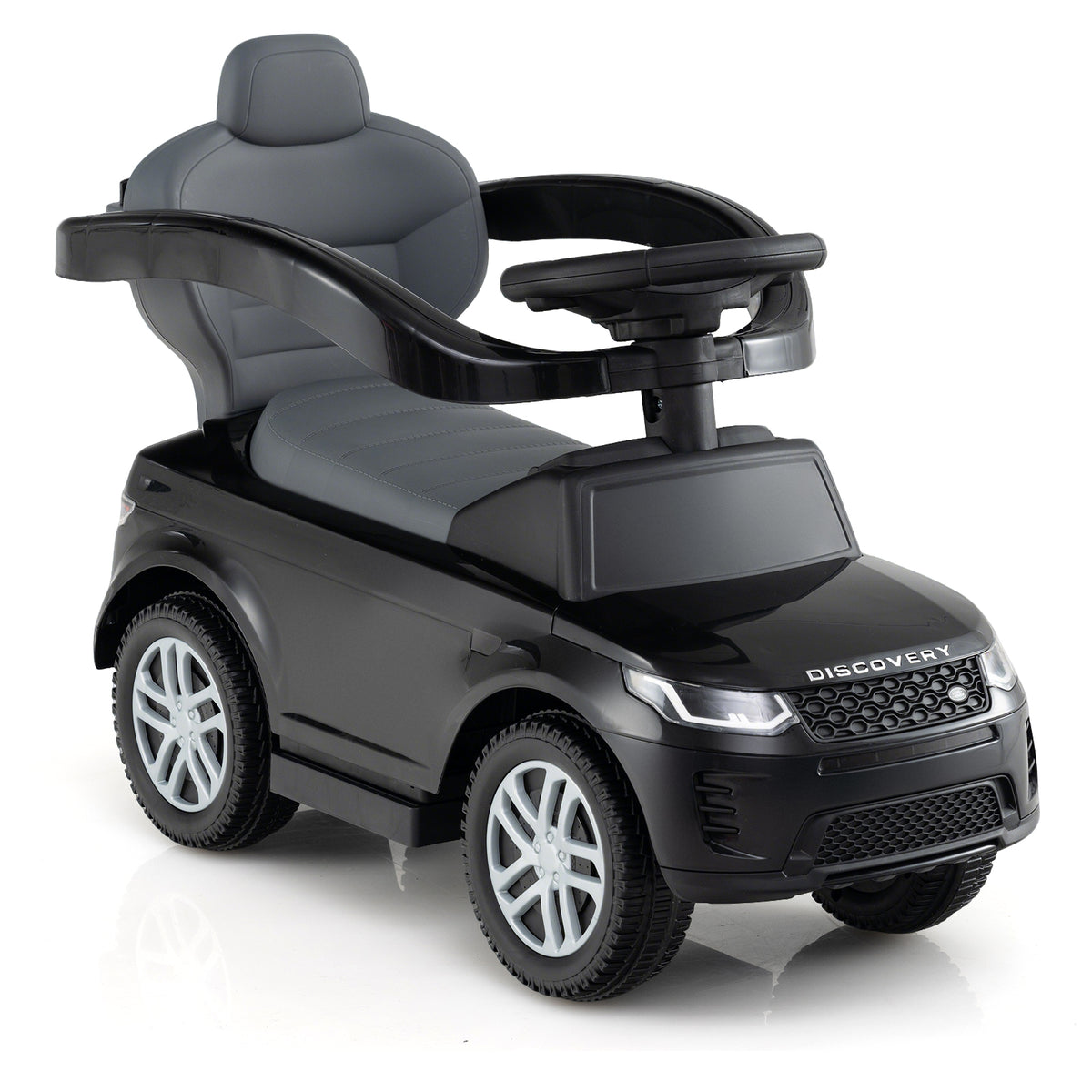 Rear view of the black push and pedal ride on toy with a high back seat