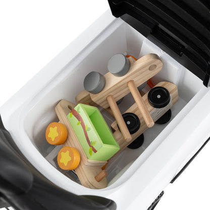 The storage compartment of the white ride on toy filled with wooden toys