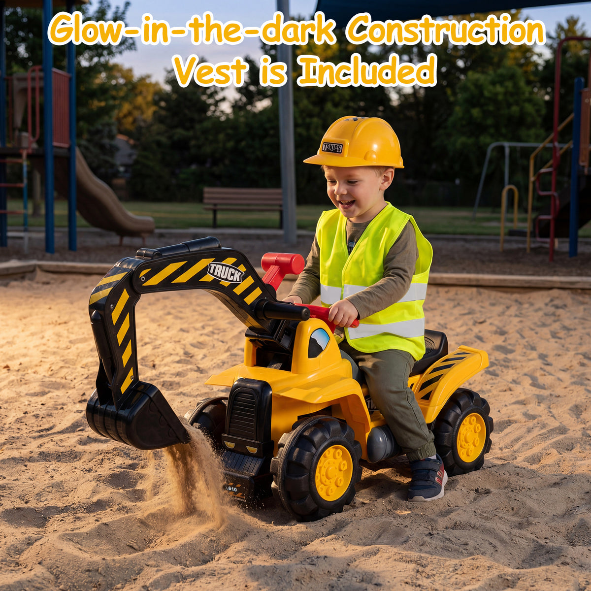 A young boy digging sand with the ride on excavator bulldozer in a playground