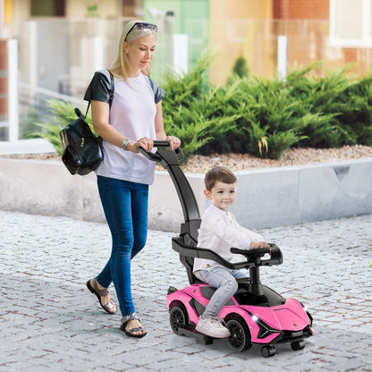 A woman pushes a child in the pink ride on push car outdoors