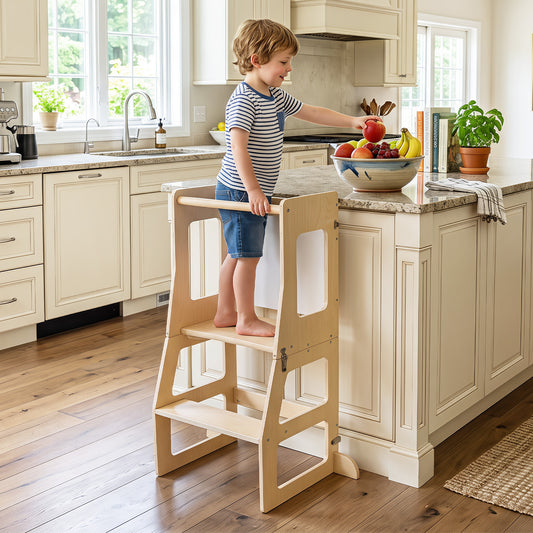 The toddler standing tower in natural wood finish is shown with a young boy reaching for fruit