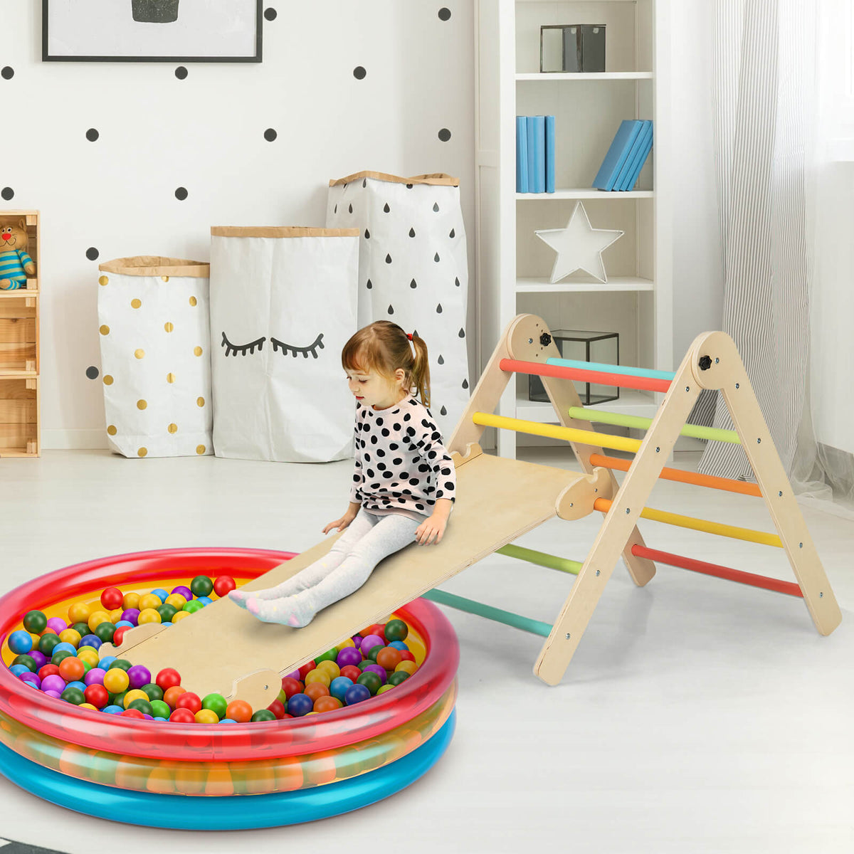 the wooden climbing frame with a ramp leading into a colourful plastic ball pit for toddlers