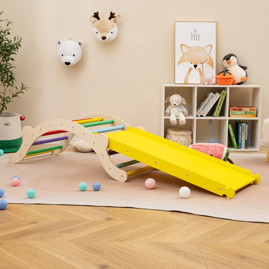 The wooden climber arch with ramp set up in a child's playroom with colourful balls scattered around
