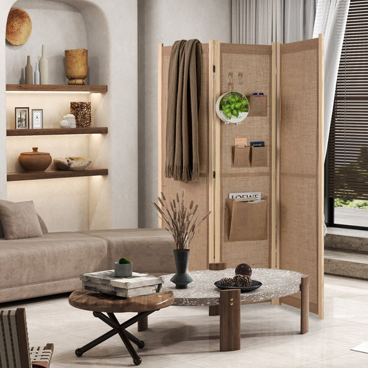 3 Panel Faux Linen Room Divider with Storage Bags standing in a modern living room with a throw blanket