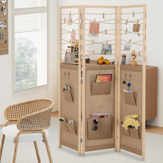 The room divider standing in a bright living room with various personal items in the pockets