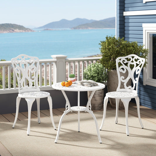 The patio furniture set placed on a wooden deck overlooking a scenic blue sea