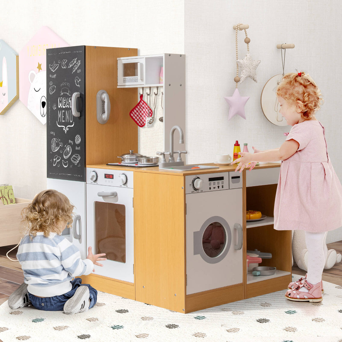 Children playing with the wooden play kitchen set in a room