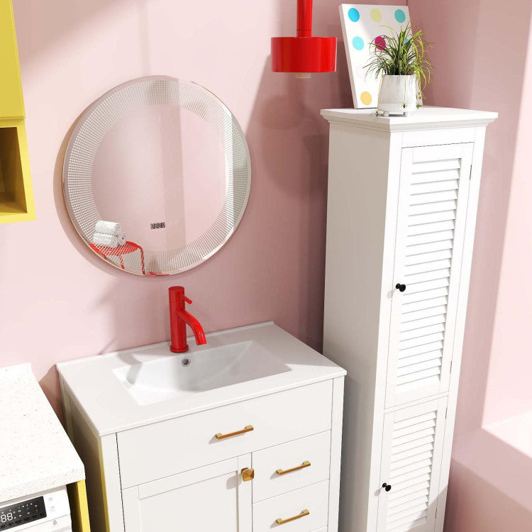 The bathroom vanity with a red tap and a tall floor cabinet next to a round mirror