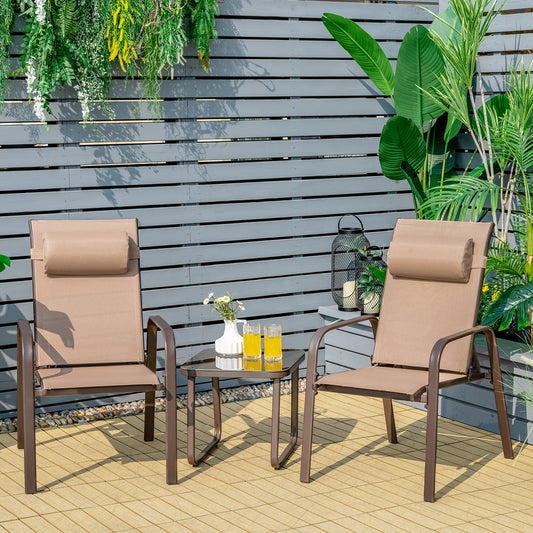 The patio furniture set is shown in a garden setting on a wooden deck