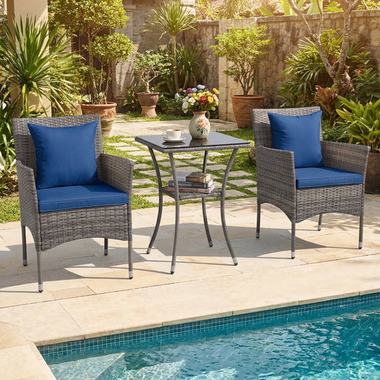 The patio furniture set placed on a stone patio beside a swimming pool