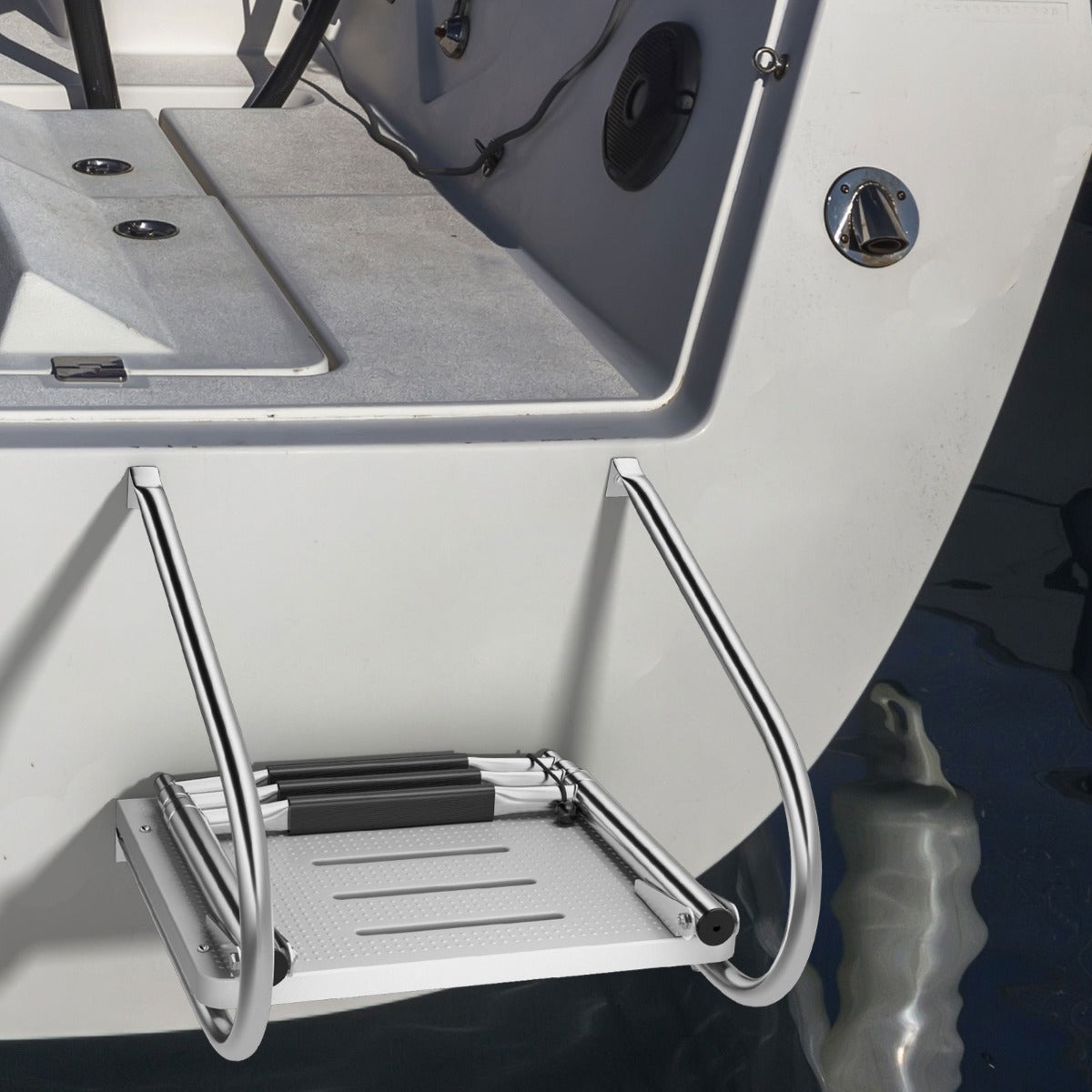 The boat ladder in a folded state attached to the back of a white boat