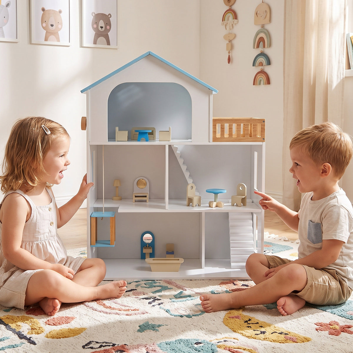 Two children playing with the wooden dollhouse playset on a rug