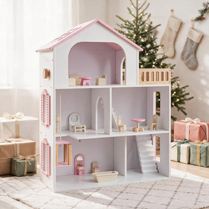 The pink wooden dollhouse set up in a festive room with wrapped gifts and a Christmas tree
