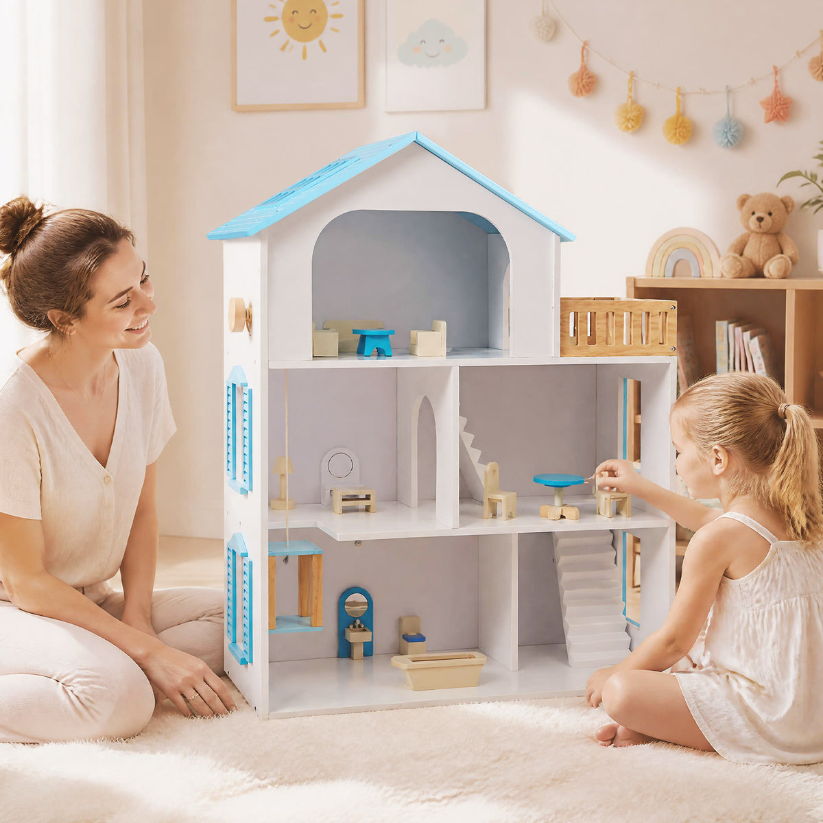 A woman and a child playing with the wooden dollhouse playset in a room