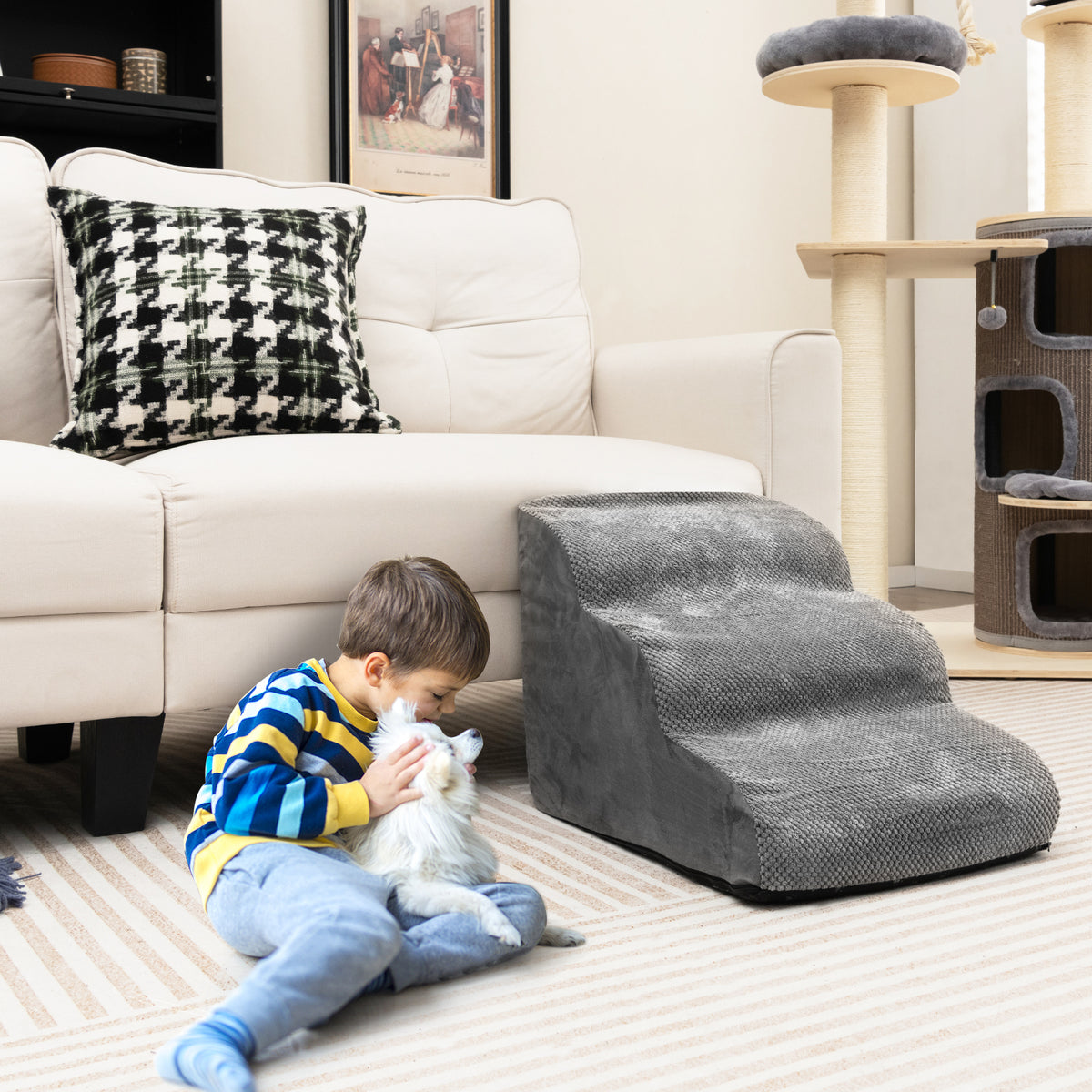 the dog ramp in grey, a child is sitting on the floor with a cat next to the steps