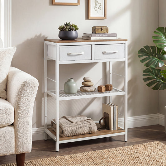 The console table placed in a living room next to a sofa with decorative items on the shelves