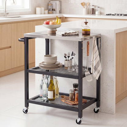 The kitchen island cart with a stainless steel top, filled with dishes and bottles