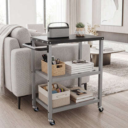 The rolling kitchen cart is displayed in a living room setting with books and a speaker on it