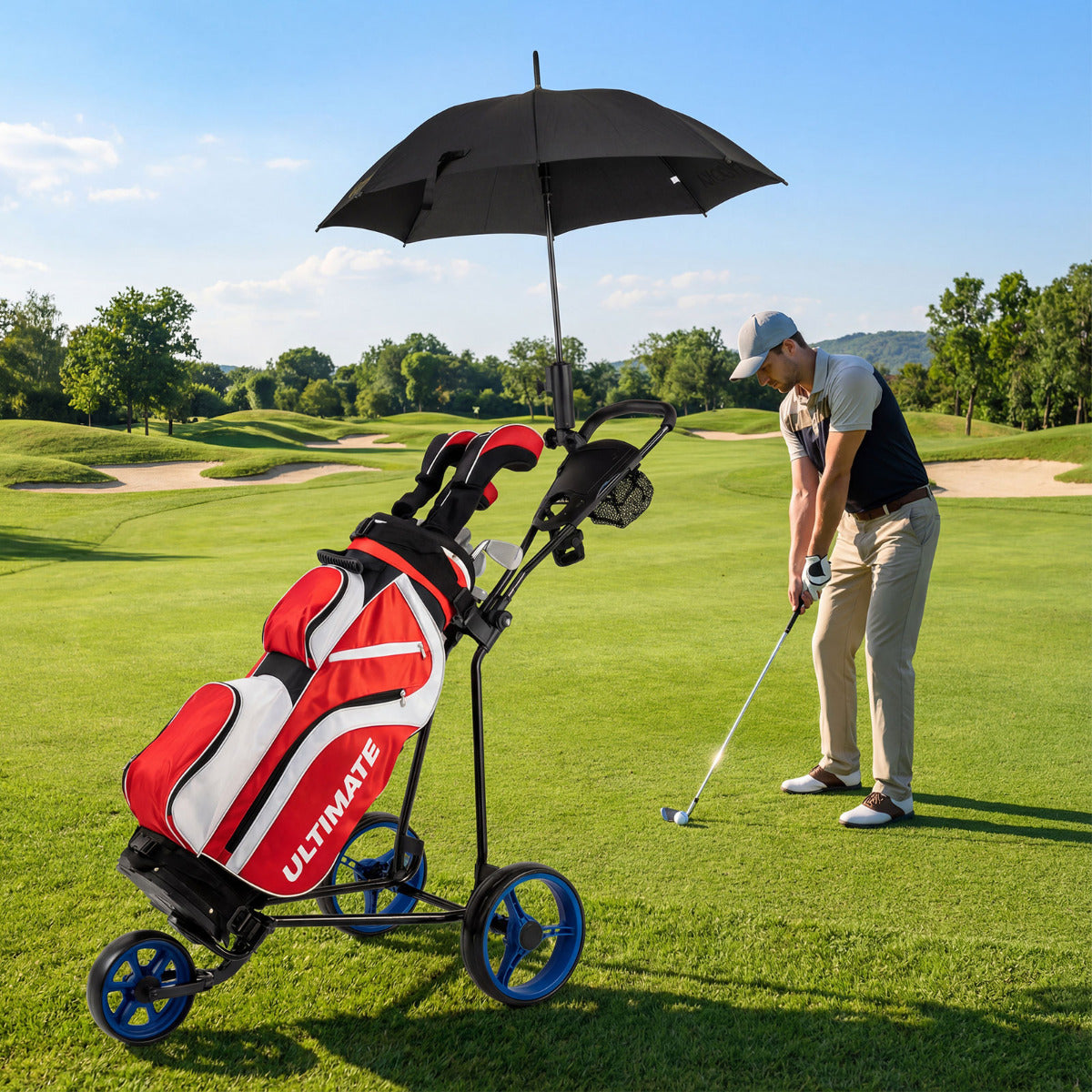 Golf push cart with a golf bag and umbrella on a golf course