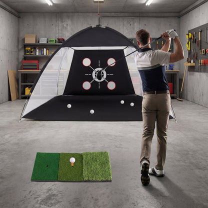 The golf practice net set up in a garage with a man hitting a ball from the hitting mat