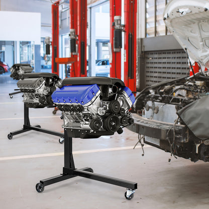 Two engine stands each holding a car engine in a workshop