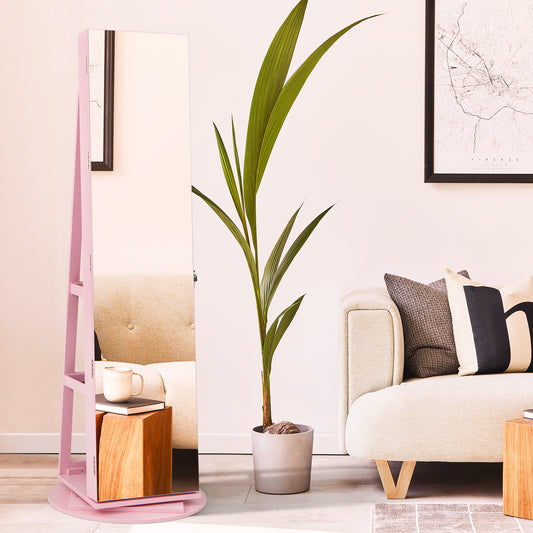 The jewellery armoire standing in a bright room next to a potted plant and a sofa