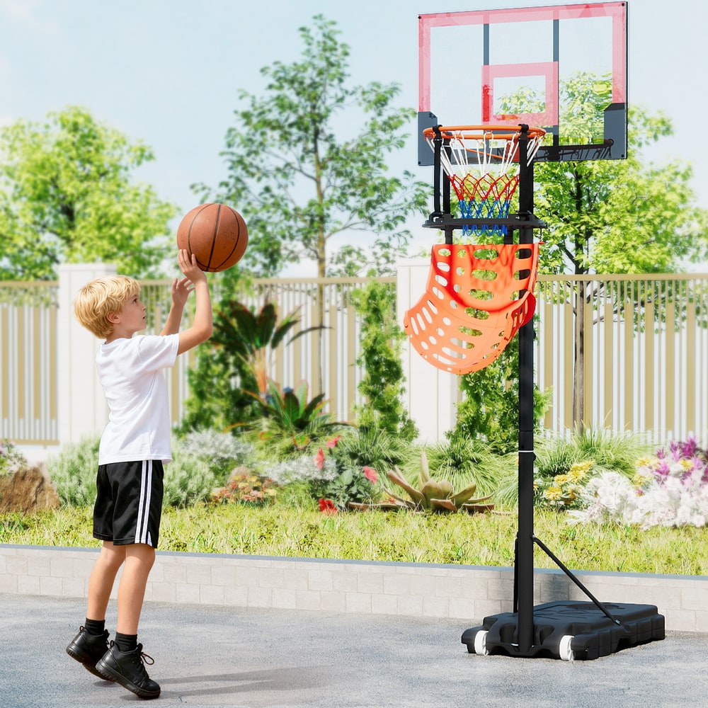The basketball rebounder in use with a young boy playing basketball