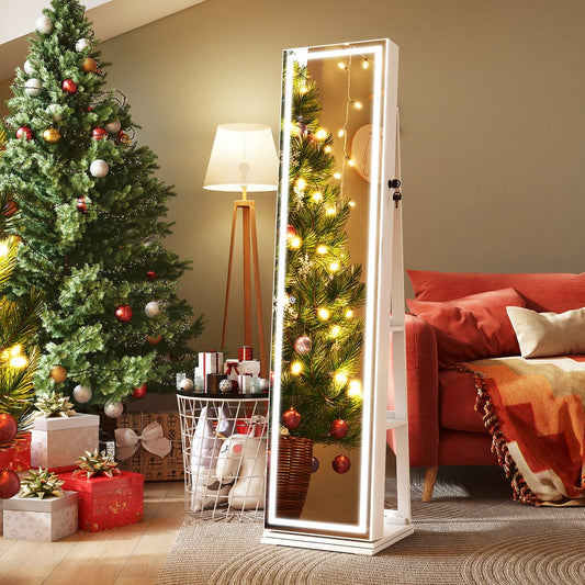 The lighted jewelry cabinet is shown in a festive room setting next to a Christmas tree