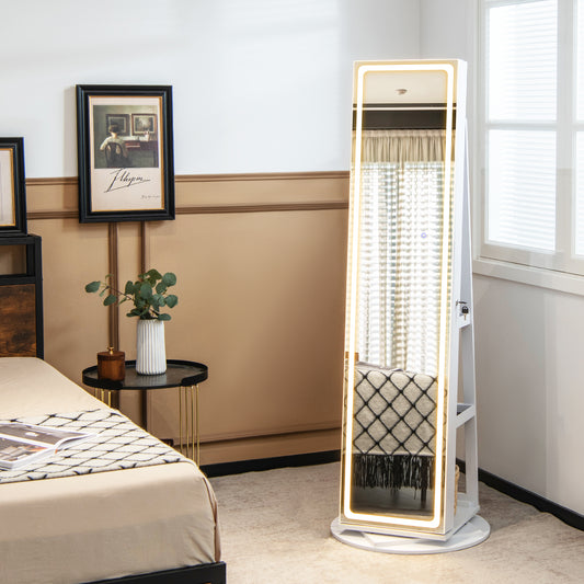 The jewelry armoire standing in a bedroom next to a bed and side table