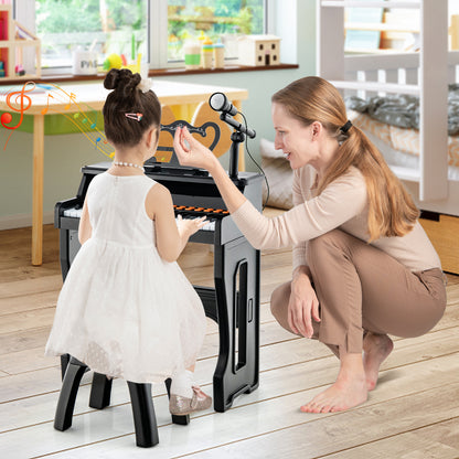 A mother and child play the electronic piano keyboard with adjustable microphone together