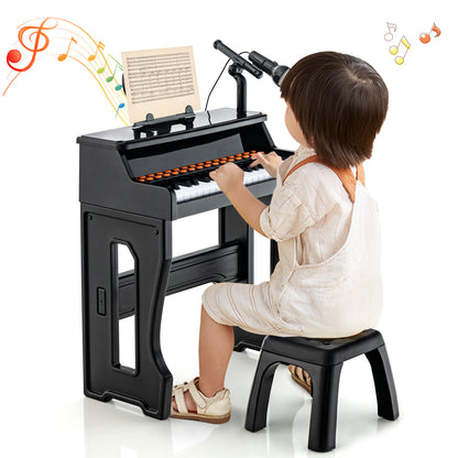 A child sits at the electronic piano keyboard with adjustable microphone, playing music
