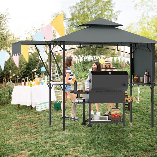 The grey grill gazebo with side awnings set up outdoors with people socialising