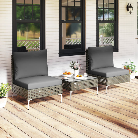 Grey rattan conversation chairs and table set on a wooden porch
