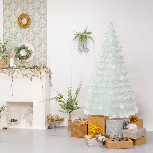 The white fiber optic Christmas tree is decorated with presents in a cosy room setting