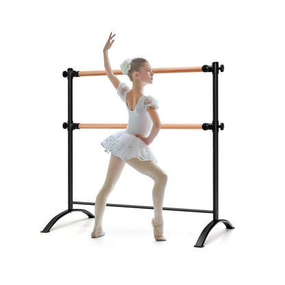 4 Feet Freestanding Ballet Barre with Height Adjustable in black with a young dancer posing