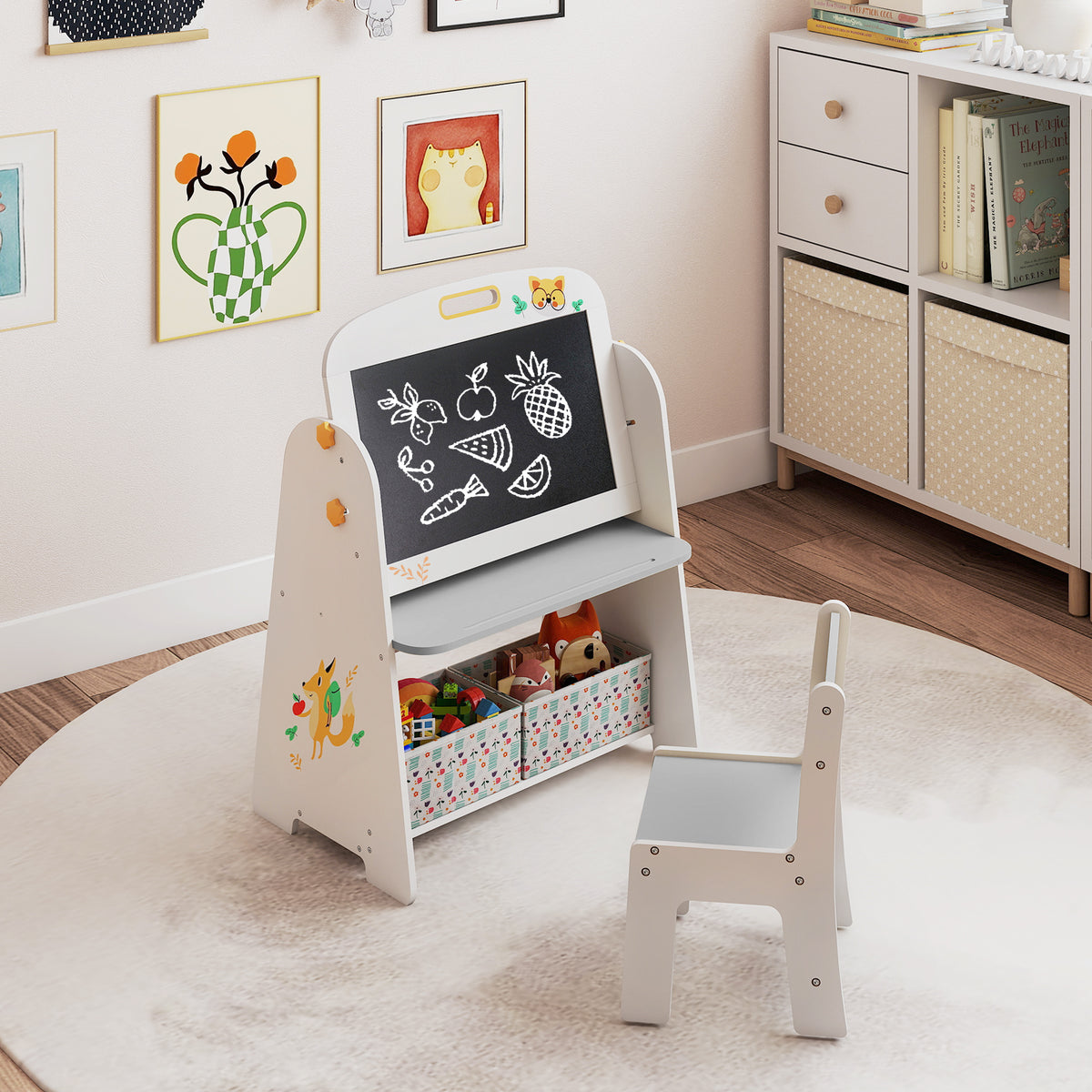 The art easel with a blackboard showing fruit drawings and a grey chair
