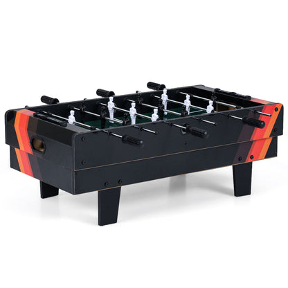 The foosball table with black and orange striped sides