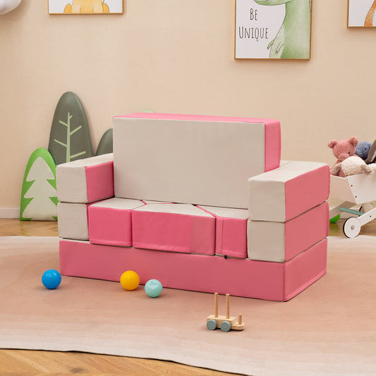 The pink and cream foam couch play set assembled as a sofa in a child's room